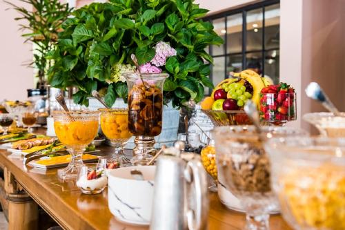 a table topped with lots of different types of food at Lanzerac Hotel & Spa in Stellenbosch