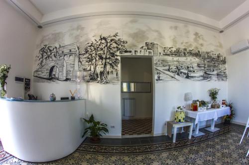 a room with a mural on the wall at VILLA ADELAIDE SUITE & ROOM in Torre a Mare