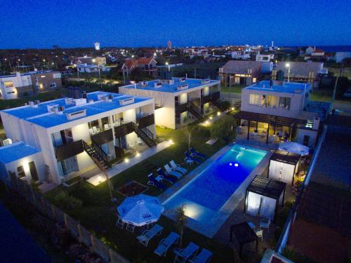 an aerial view of a house with a swimming pool at night at Cara Colomba in La Paloma