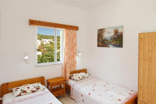 Postel nebo postele na pokoji v ubytování Villa Stamatis