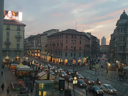 a busy city street with cars on the road at Hotel Stradivari in Milan