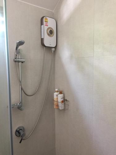 a shower in a bathroom with a shower at Bulan Villa rayong in Rayong