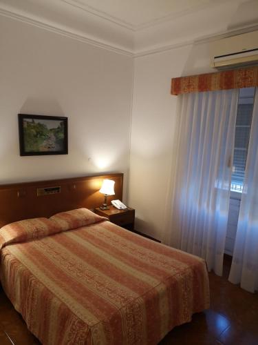 Postel nebo postele na pokoji v ubytování Hotel Nazareth