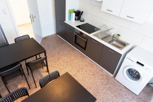 Kuchyň nebo kuchyňský kout v ubytování AVR Apartment Geestemunde 2