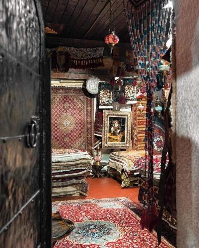 an entrance to a room filled with carpets and a room at Apartment Milk&Honey - free Parking in Sarajevo