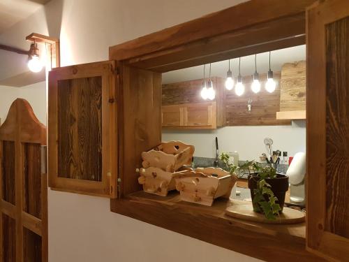 a kitchen with a counter with some boxes on it at La Girandole Chambre d'hôtes et Location d'appartement in Arvieux
