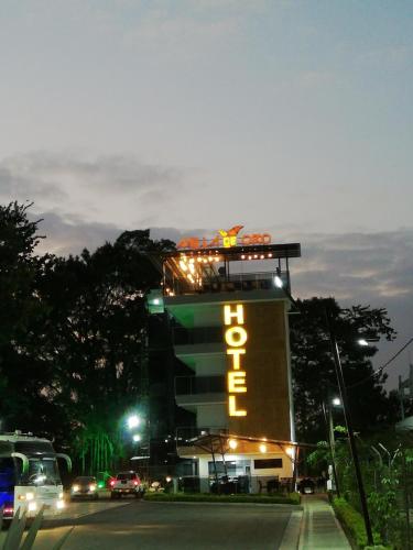 a building with a sign that says hotel at Hotel Milla de Oro Uraba in Apartadó