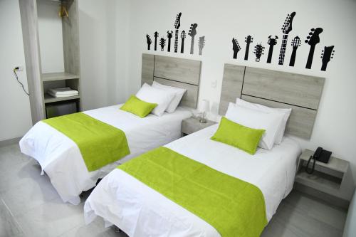 Postelja oz. postelje v sobi nastanitve Hotel Milla de Oro Uraba