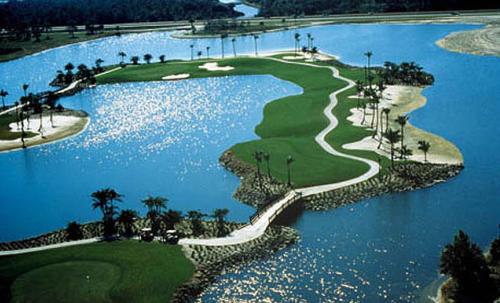 an aerial view of a golf course with water at GreenLinks Golf View Villa Mustang at Lely Resort in Naples