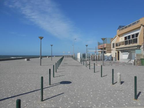 a row of street lights in a parking lot at Casa na Praia do Mindelo in Mindelo