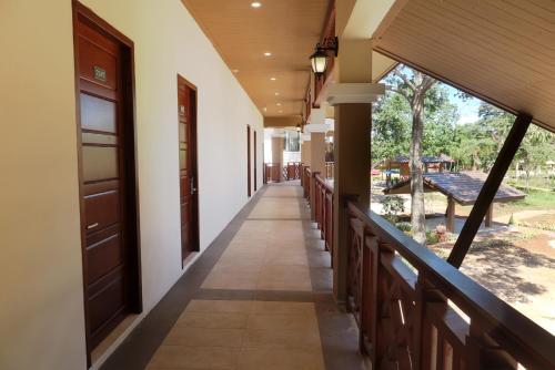 a corridor of a building with a balcony at Sabaidee Valley in Ban Gnik