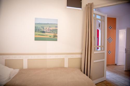 Ein Bett oder Betten in einem Zimmer der Unterkunft Zythogite Appartement 8 personnes avec jardin, bbq