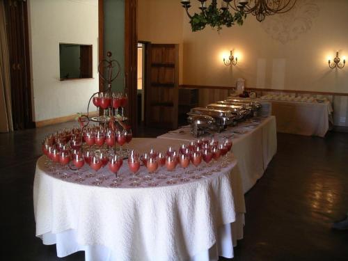 a row of wine glasses sitting on a table at Villa Jana Guesthouse in Pretoria