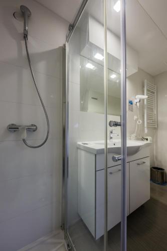 a bathroom with a shower and a sink at Hotel Sveti Kriz in Trogir