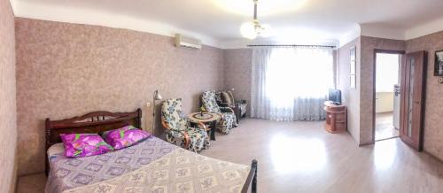 Кровать или кровати в номере Apartment On Moskovskaya 27