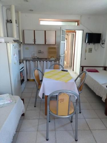 a kitchen with a table and chairs in a room at Leticia y Fabián in Gualeguaychú