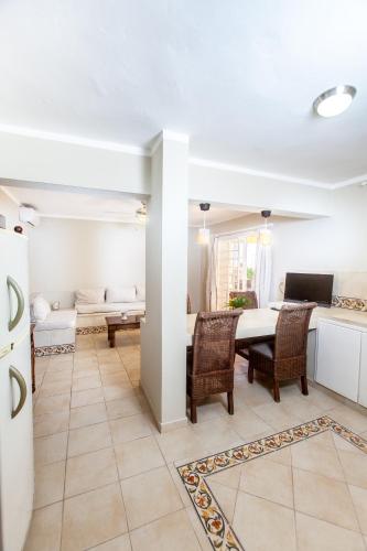 a kitchen and dining room with a table and chairs at Villas Chiara Punta Cana in Punta Cana