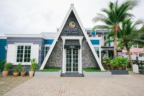a welcome change sign in front of a building at Royale Chenang Resort in Pantai Cenang