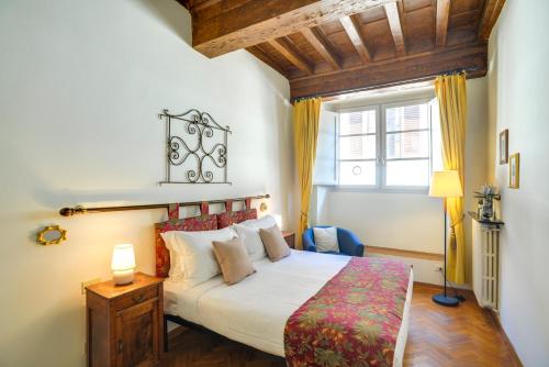 เตียงในห้องที่ Mamo Florence - Palazzo Spinelli Apartment