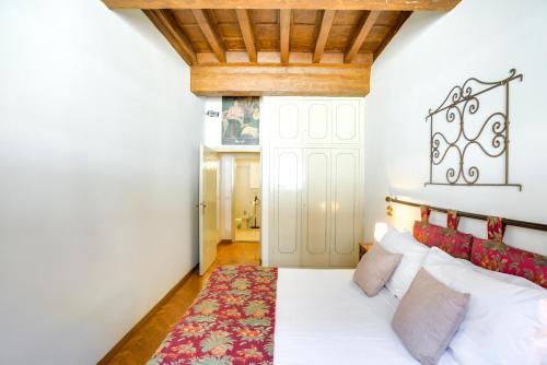 Postel nebo postele na pokoji v ubytování Palazzo Spinelli Apartment by Mamo Florence