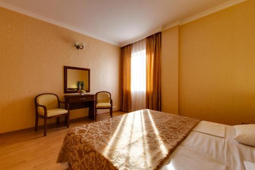Cama o camas de una habitación en Vizit Hotel