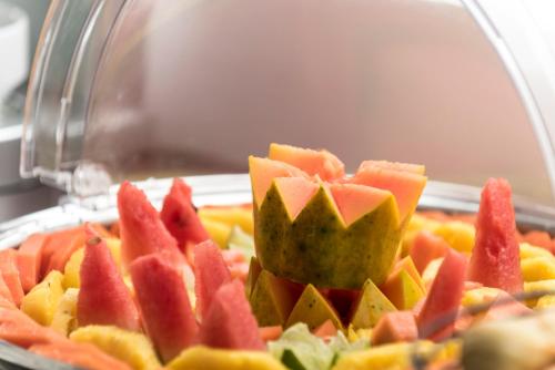 a pile of fruit on top of a plate at Foresta Hotel in Medellín