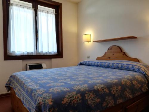 Tempat tidur dalam kamar di Residence Borgo al Sole