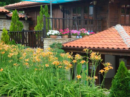 a garden filled with lots of flowers and plants at Voevodski Eco Complex in Katunishte