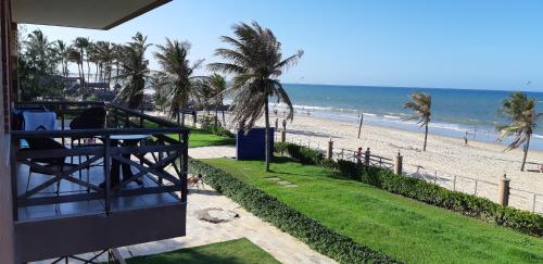 a view of the beach from the balcony of a resort at Manacá Apartamentos , Kariri Beach , Cumbuco in Cumbuco