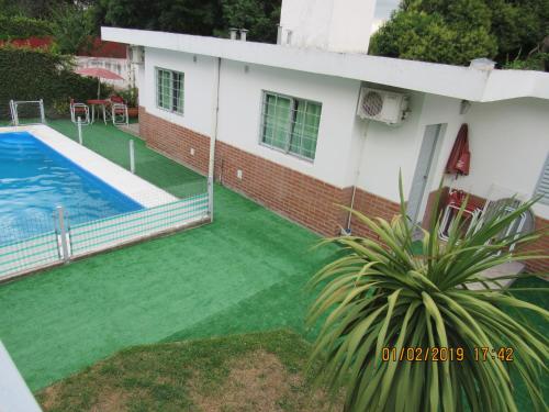 a view of a house with a swimming pool at Departamento Carlos Paz in Villa Carlos Paz