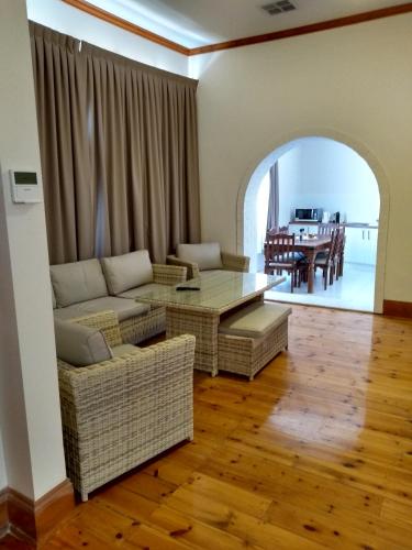 a living room with a couch and a table at Birdwood Motel in Birdwood