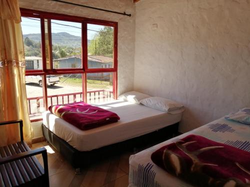 En eller flere senge i et værelse på El Nuevo Mirador