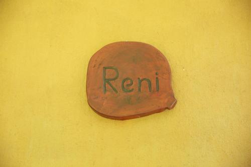 a red sign on a yellow wall with the word rent at Limecabanas-srilanka in Galle