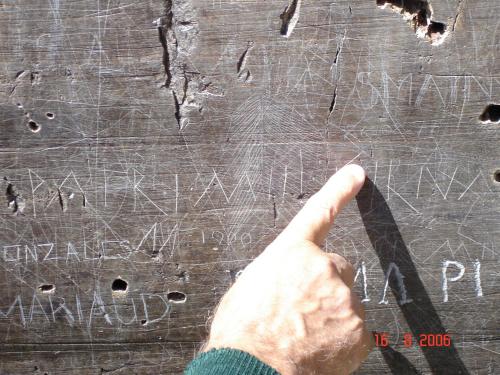 a hand is pointing at a chalkboard with handwriting at Le Prieuré in Saint-Dalmas-de-Tende