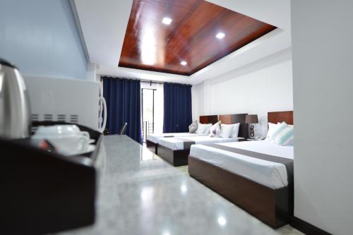 Katil atau katil-katil dalam bilik di Hotel Gabriella