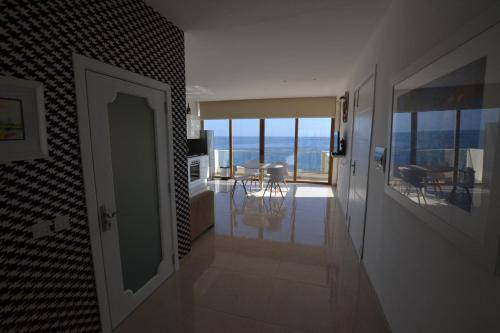 a hallway with a room with a view of the ocean at Valletta Dream Suites Penthouse in Valletta