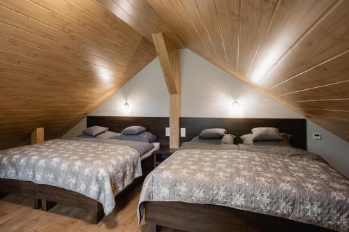 Posteľ alebo postele v izbe v ubytovaní Apartamenty TRZY KOLORY