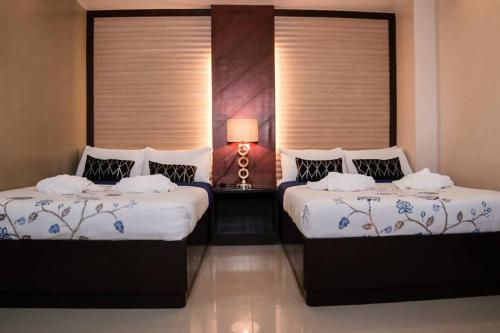 Cama o camas de una habitación en Mezza Hotel