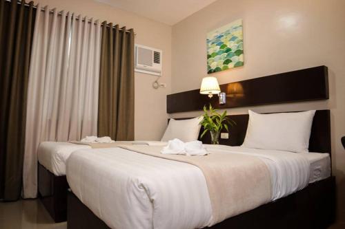 Cama o camas de una habitación en Mezza Hotel
