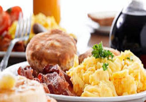 a plate of breakfast food on a table at Matoppo Inn in Beaufort West