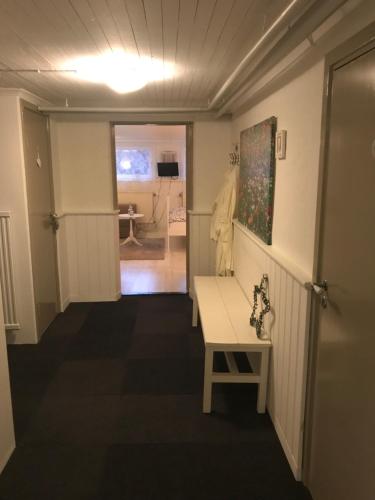 a hallway with a table in a room at Room with pentry, separate entrance, no cardpayment in Gränna