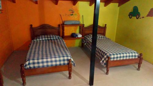 En eller flere senge i et værelse på La Casona de Gise