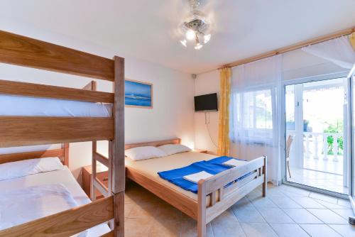 Postel nebo postele na pokoji v ubytování Apartman Jurcic