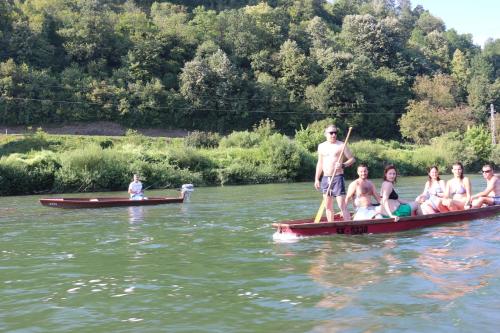 a group of people on a boat in the water at Holiday homes Piralo in Kostajnica