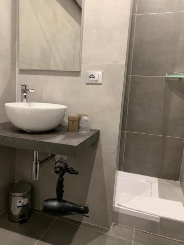 a bathroom with a sink and a shower at ApartHotel Bossi in Milan