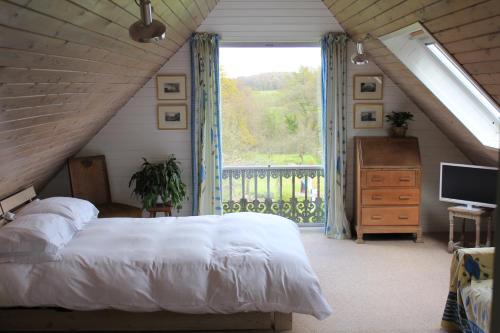 Ένα ή περισσότερα κρεβάτια σε δωμάτιο στο Brook Barn
