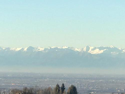 a view of snow covered mountains in the distance at Villaggio Bianco in San Giacomo
