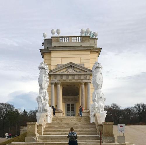 a woman standing in front of a building at Schön wohnen nähe Schönbrunn in Vienna