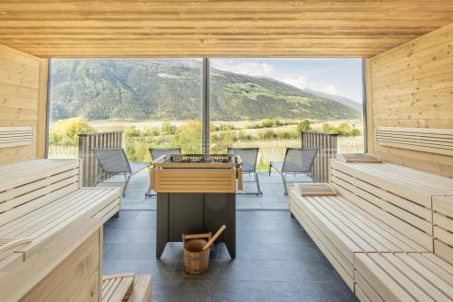 a sauna with a view of the mountains at Vinschgerhof in Silandro