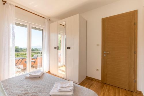 Ένα ή περισσότερα κρεβάτια σε δωμάτιο στο Villa Duje